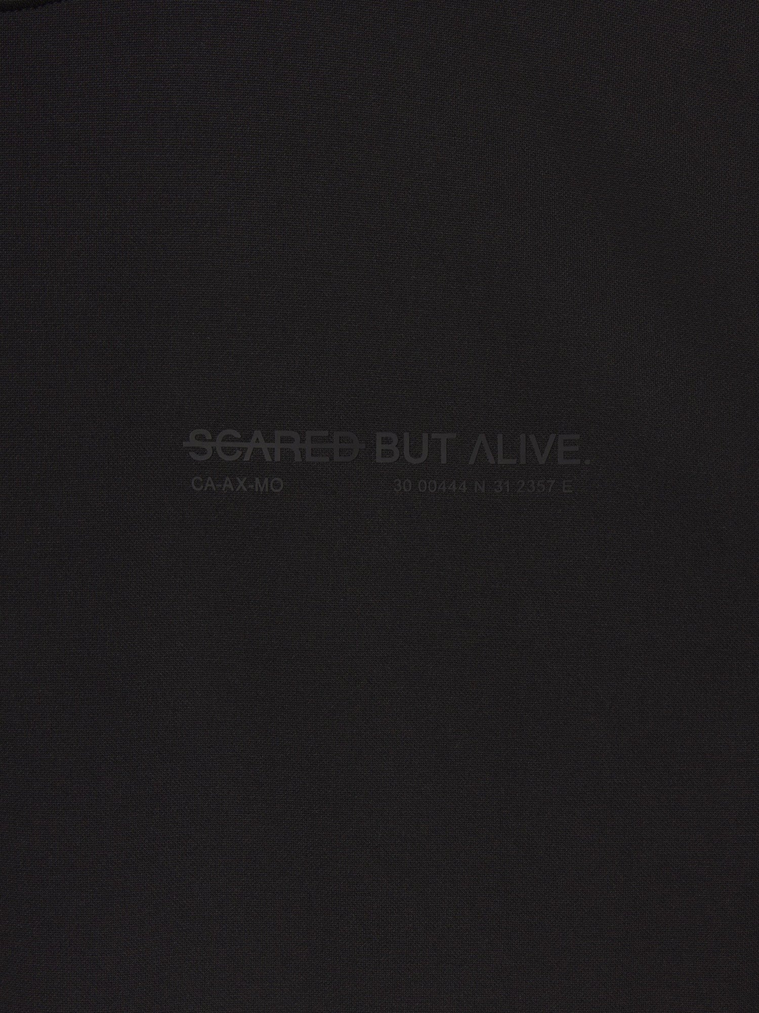 Stockholm Tank Black Out fabric and raw-edge construction detail