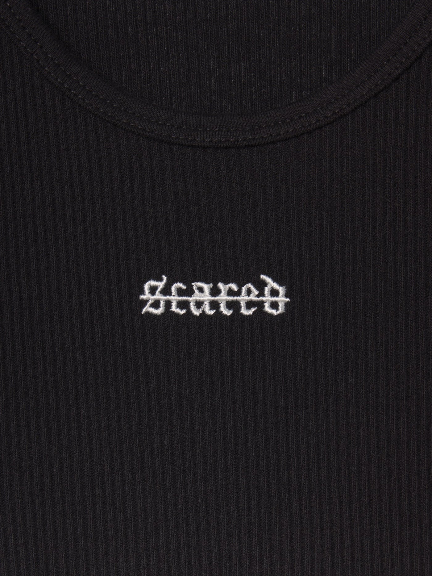 Ibiza Rib Tank Black Out fabric and construction flat-lay detail