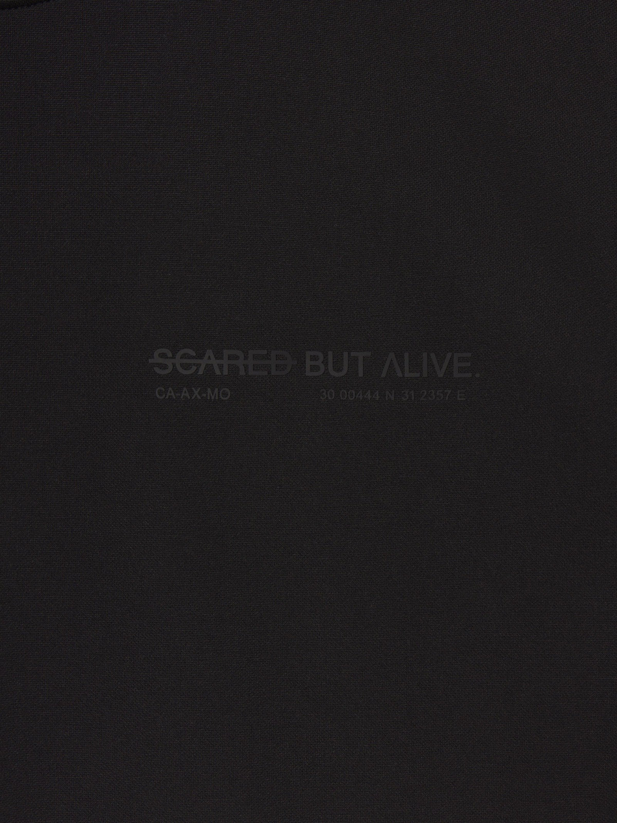 Stockholm Tank Black Out fabric and raw-edge construction detail