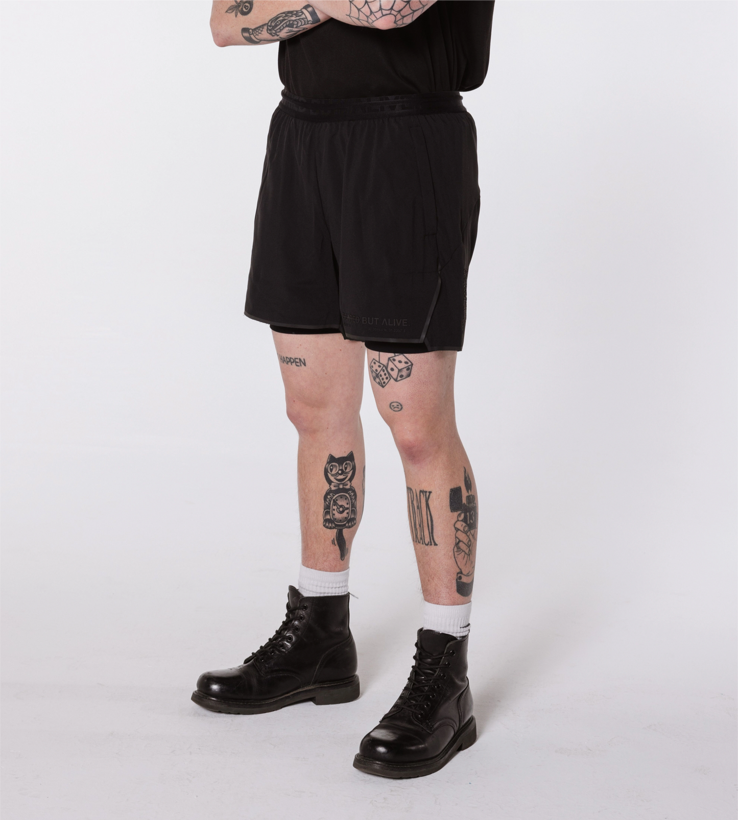 [Color: Black Out] An angled image of the model wearing the Berlin Shorts