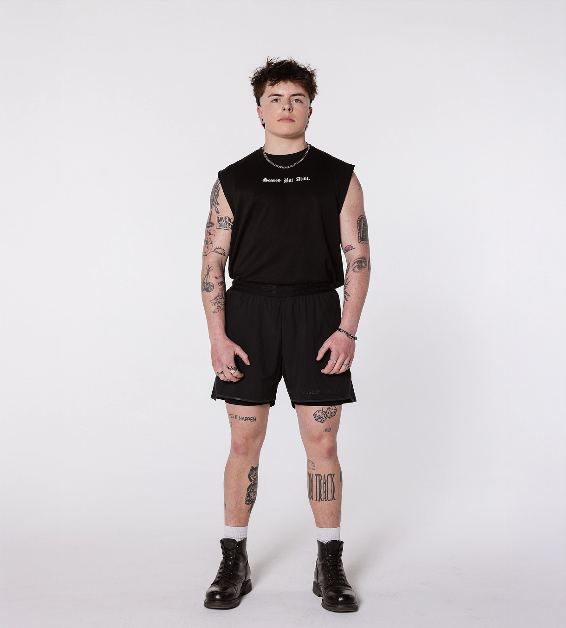 [Color: Black Out] Model wearing the Berlin Shorts and the London Tank