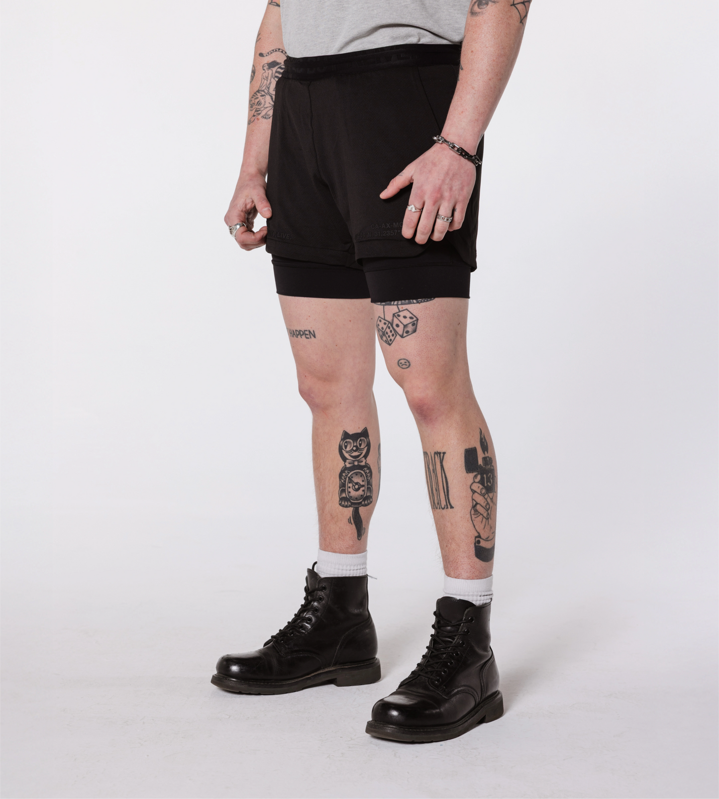 [Color: Black Out] an angled image of the model wearing the Hawaii Shorts