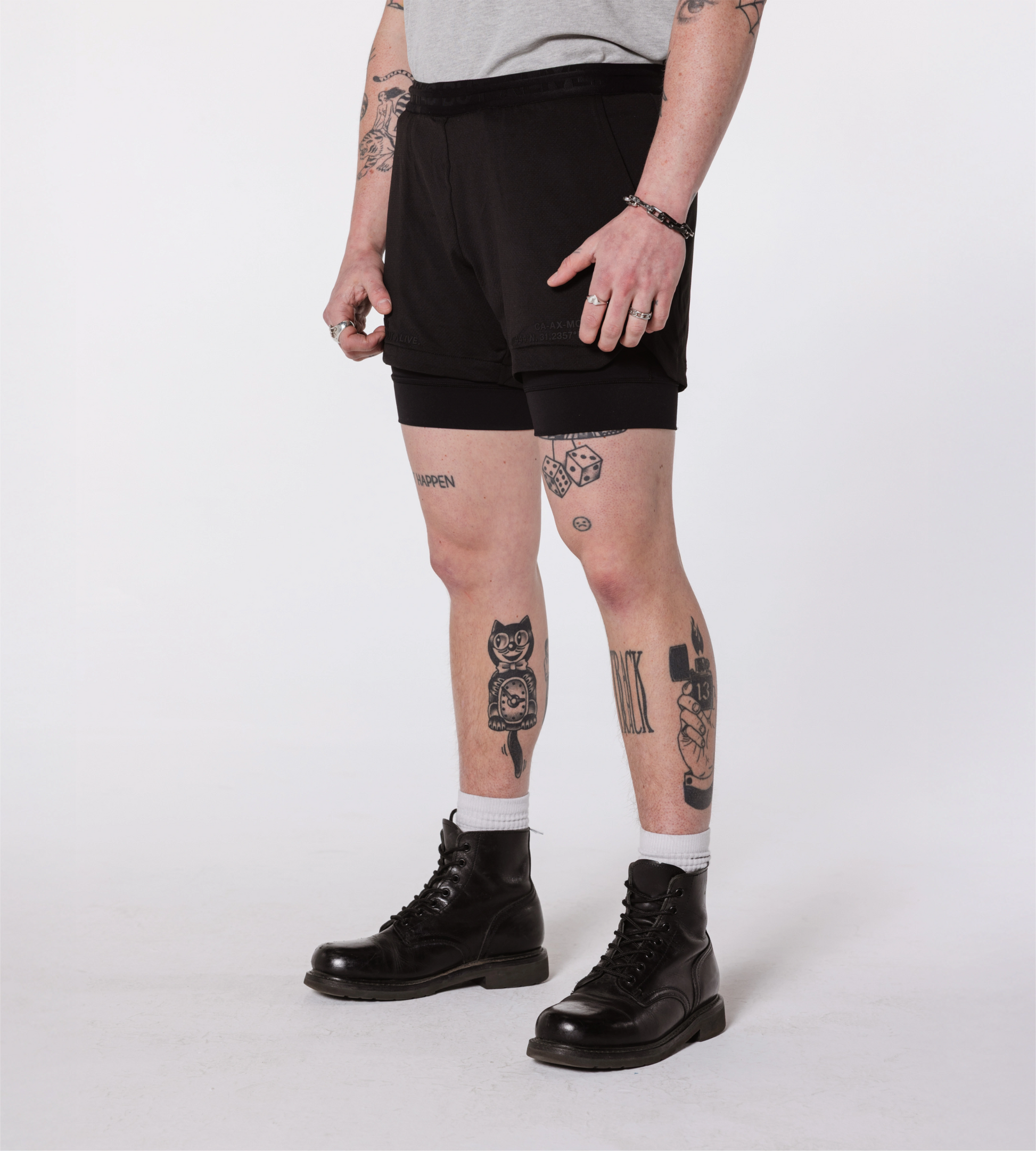 [Color: Black Out] an angled image of the model wearing the Hawaii Shorts