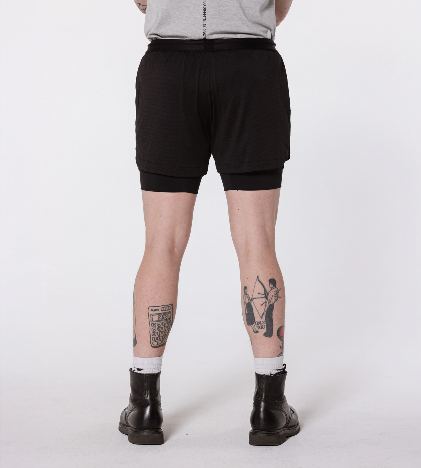 [Color: Black Out] Model wearing the Hawaii Shorts, showcasing the back details of the outfit