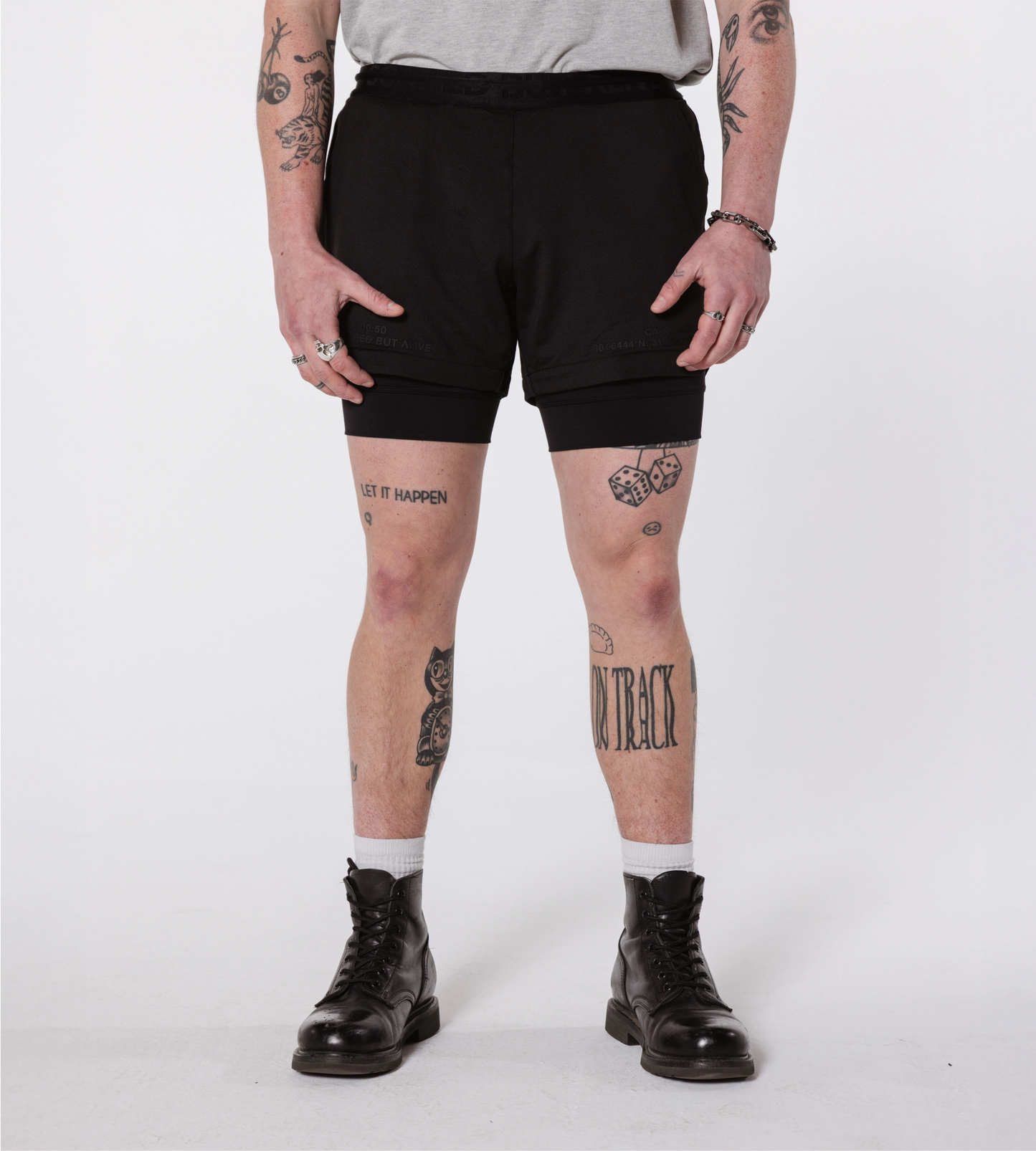 [Color: Black Out] Model wearing the Hawaii Shorts, showcasing the front details of the outfit.