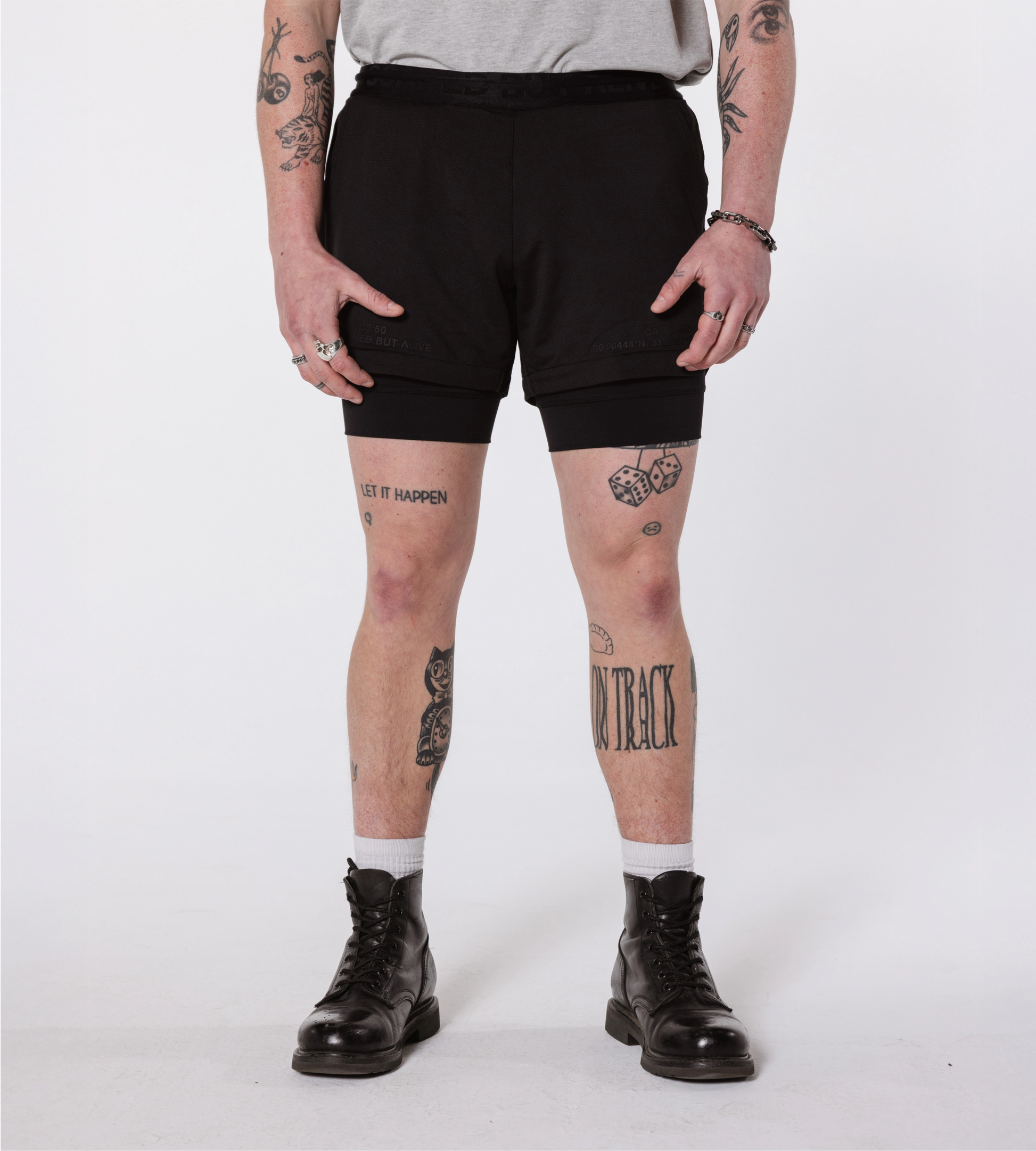 [Color: Black Out] Model wearing the Hawaii Shorts, showcasing the front details of the outfit.