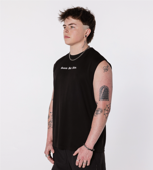 [Color: Black Out] Model wearing the Scared But Alive London Tank in an angled position