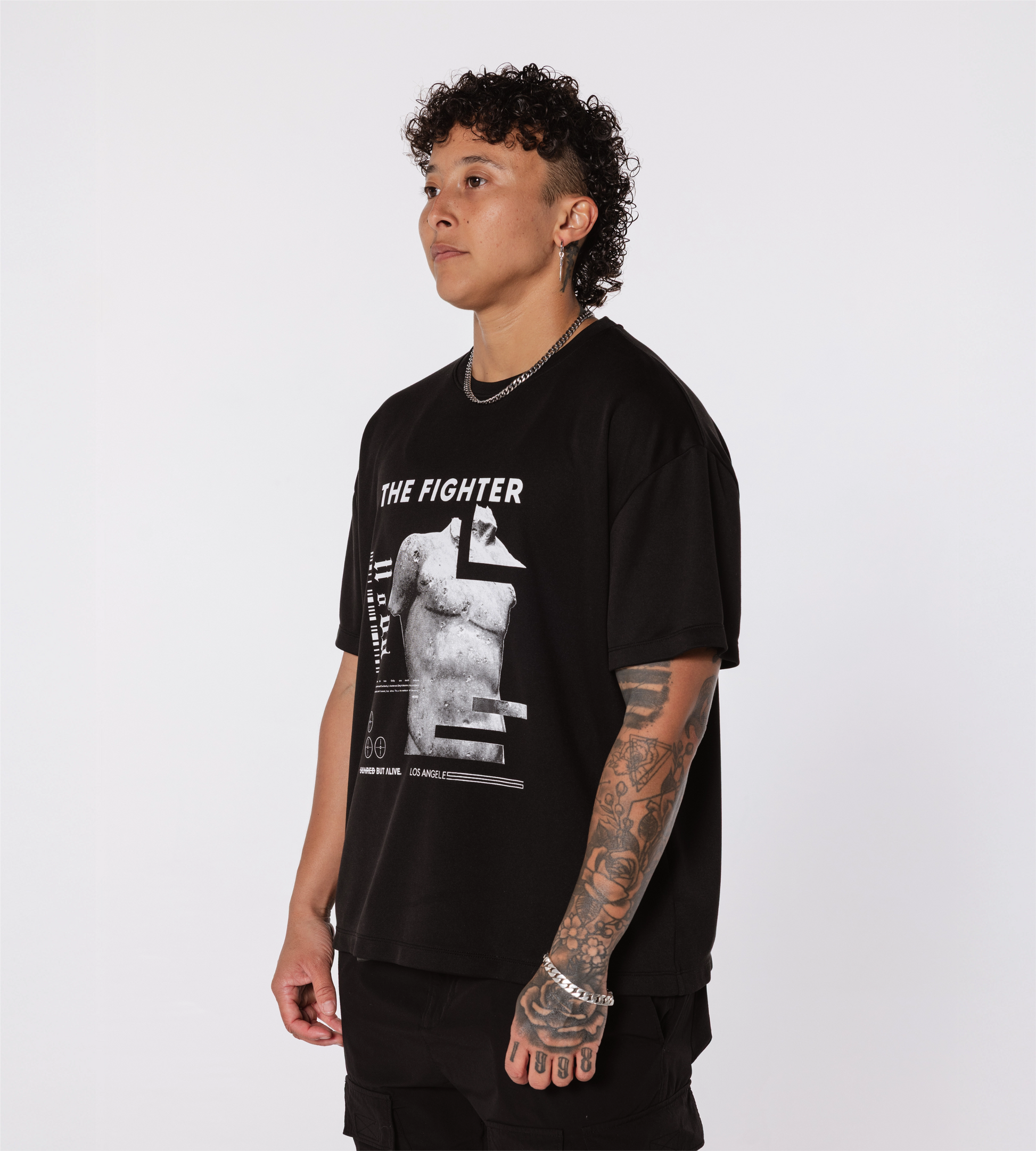 [Color: Black Out] Model wearing the Rome Fighter Tee, in an angled position