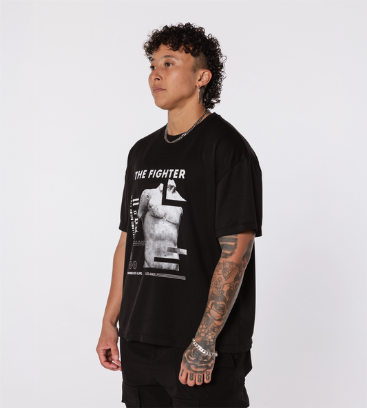 [Color: Black Out] Model wearing the Rome Fighter Tee, in an angled position
