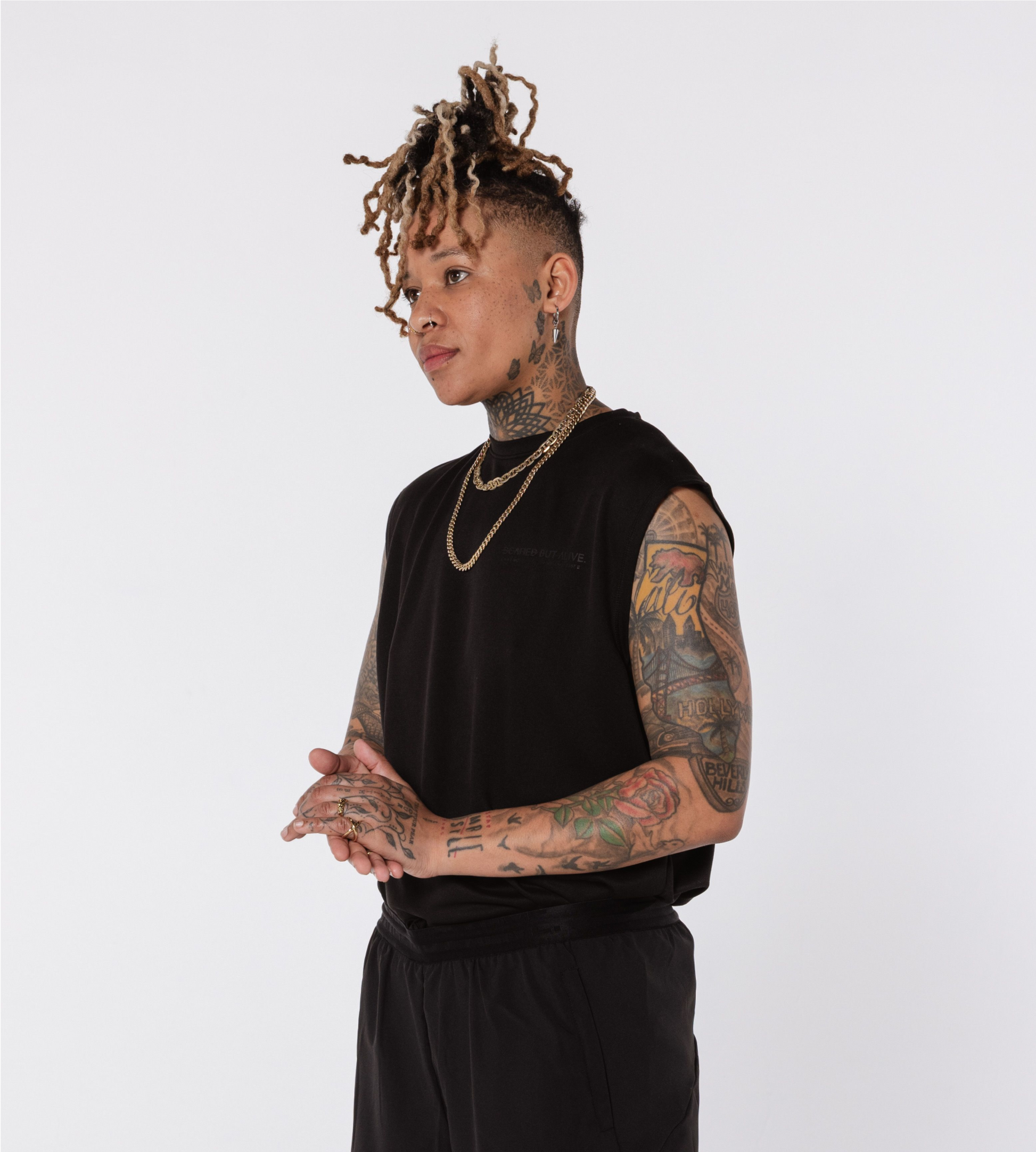 [Color: Black Out] An angled image of a model wearing the Stockholm Tank