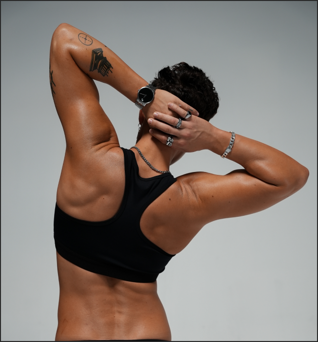 Back view of model flexing while wearing Sydney Sports Bra