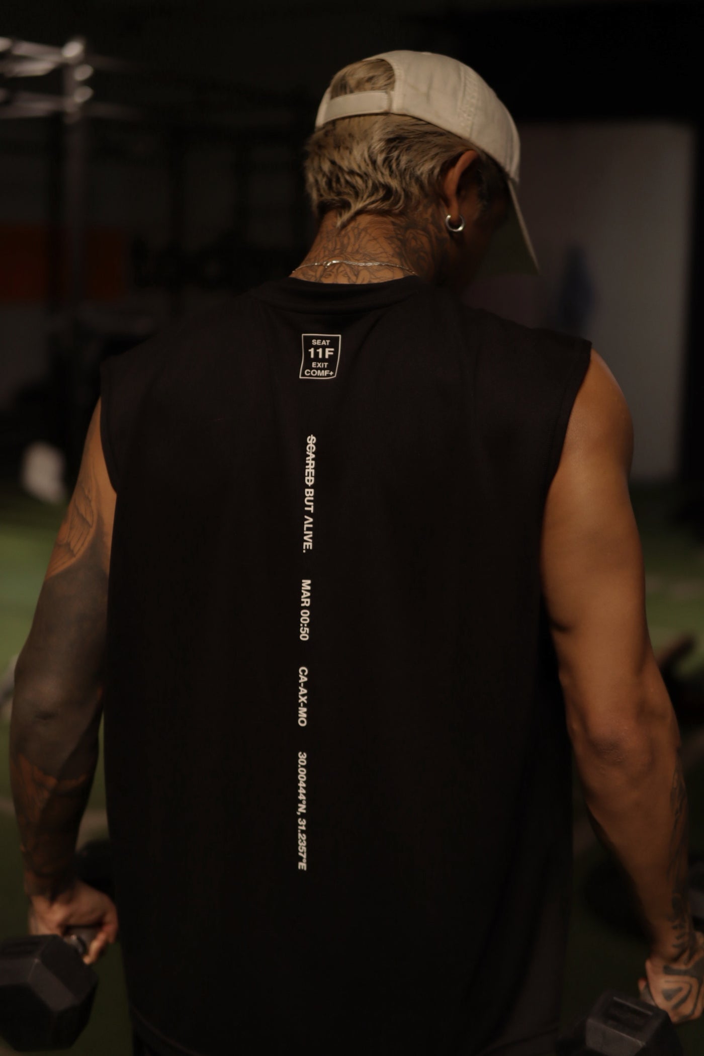 London Tank Black Out back spine detail after hours