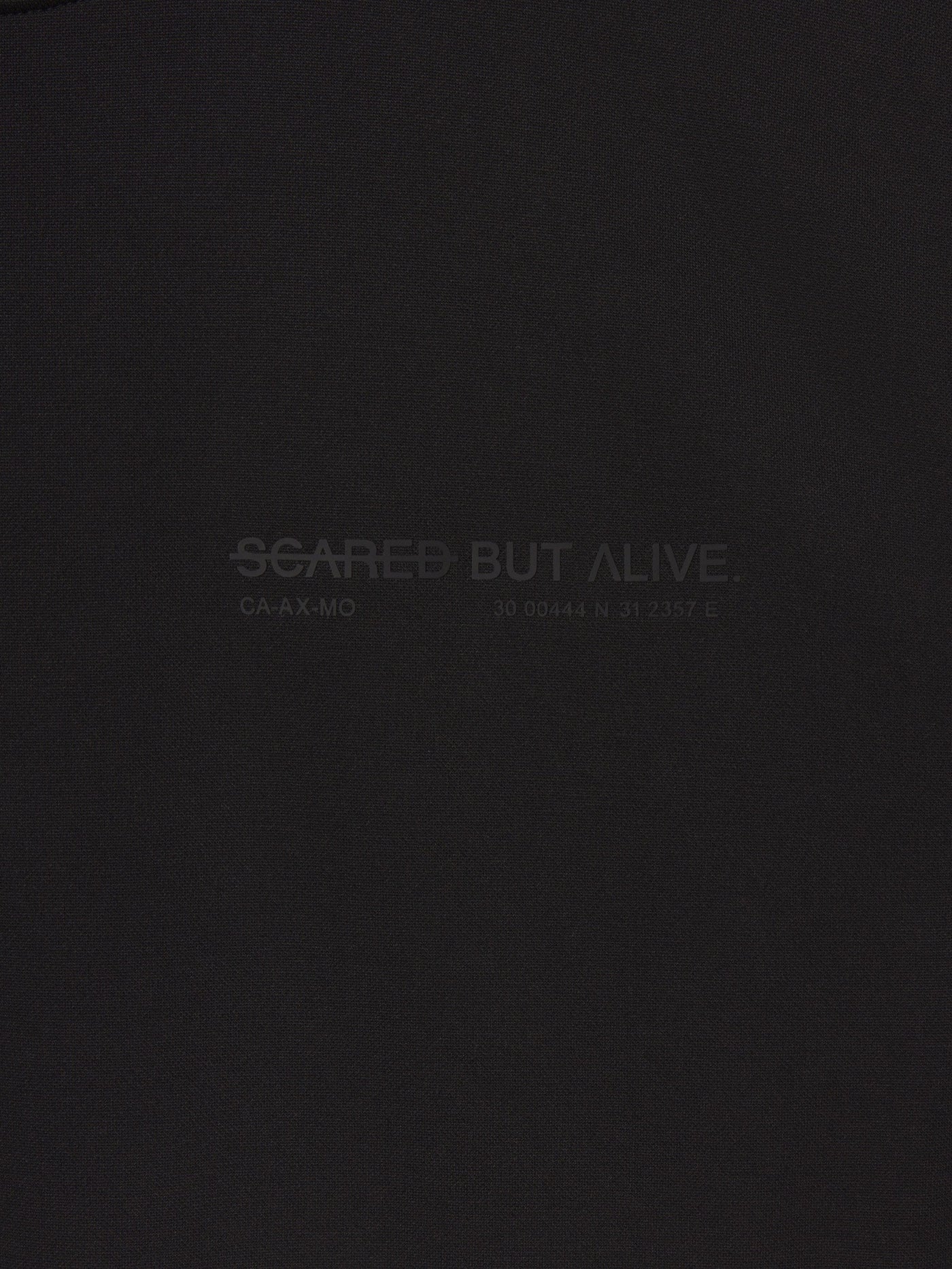 Stockholm Tank Black Out fabric and raw-edge construction detail