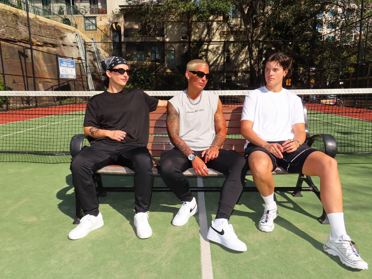 Scared But Alive three person court lineup with Bristol Tee White Space