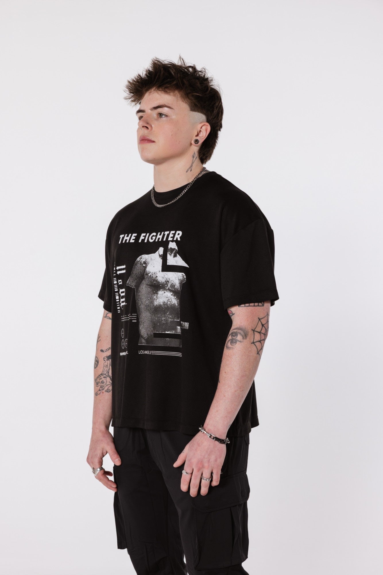 The Fighter Tee worn on-body, side profile